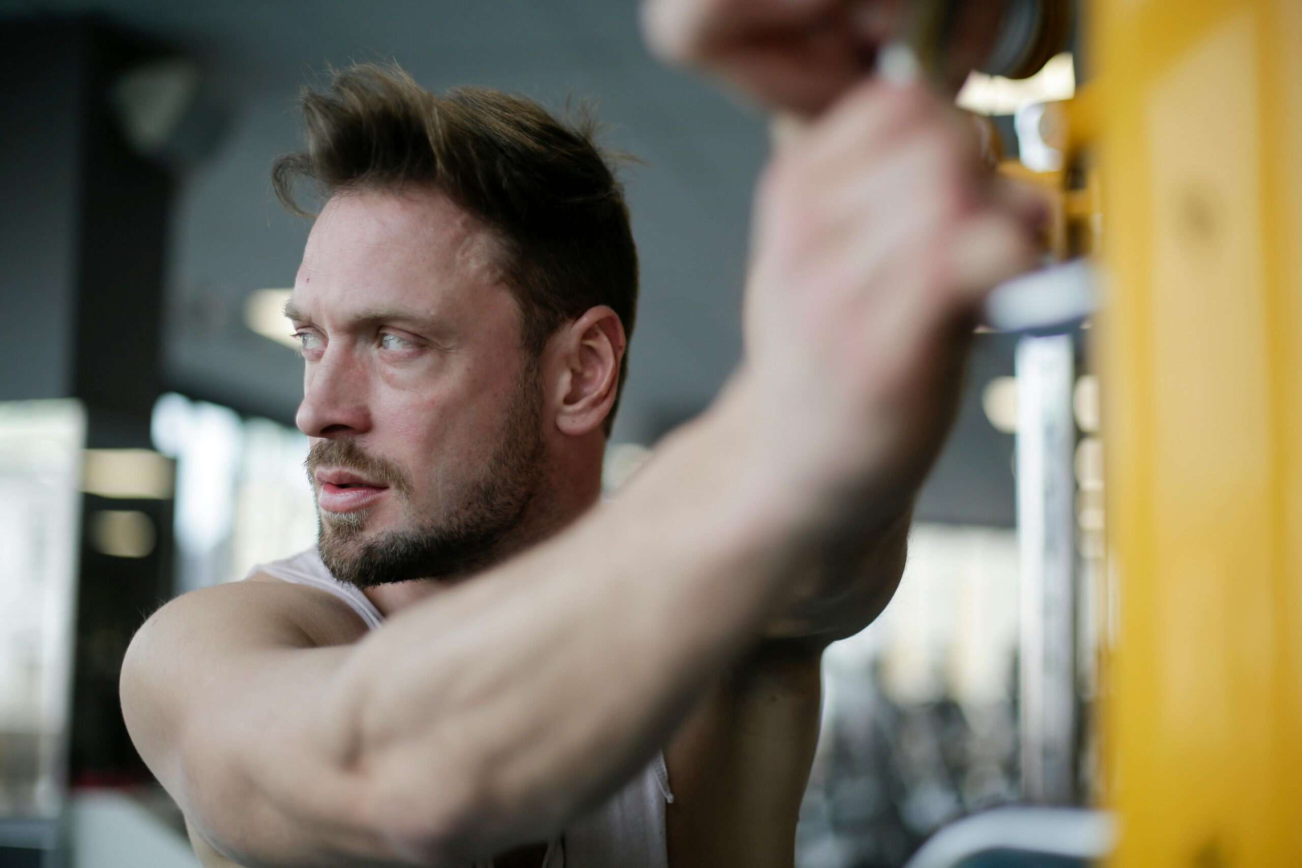 A person performing strength training exercises to build muscle naturally and improve overall health and fitness.